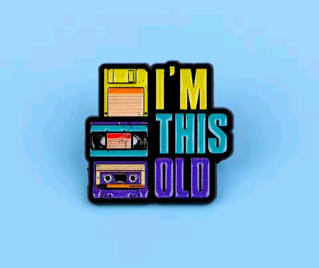 Enamel pin with cassette stack and text 'I'm This Old'