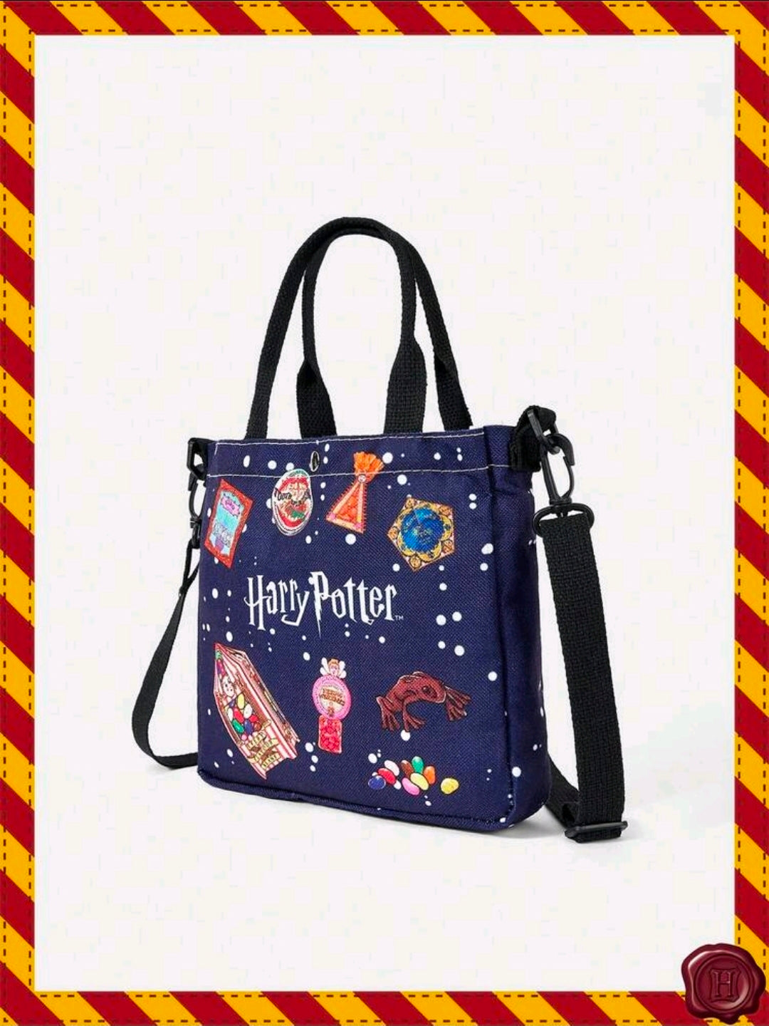 Navy canvas tote bag front view with black handles and crossbody strap, colorful charm print