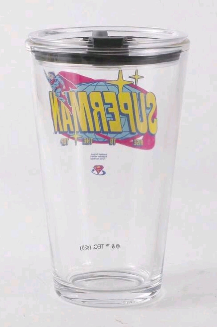 Clear Superman glass tumbler with black lid, side graphic view