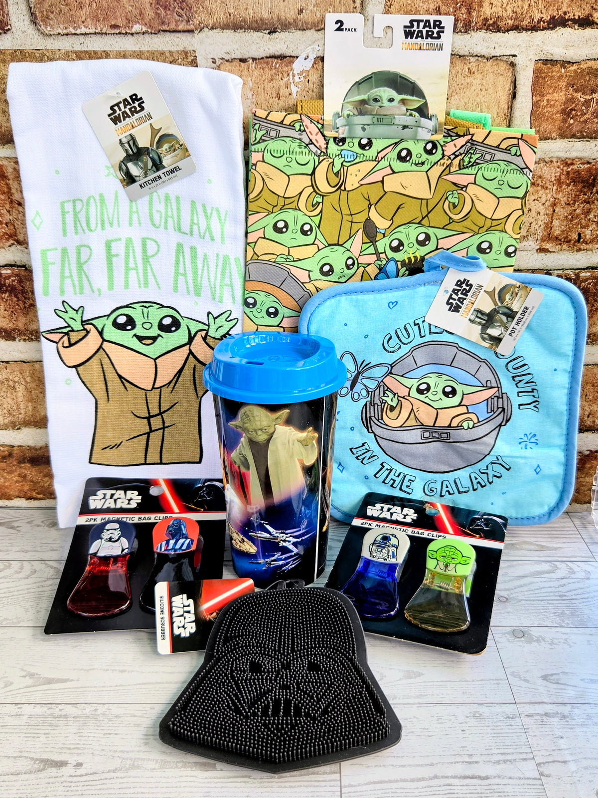 Star Wars Grogu gift set with white graphic T-shirt, blue pouch, tumbler, socks, black cap