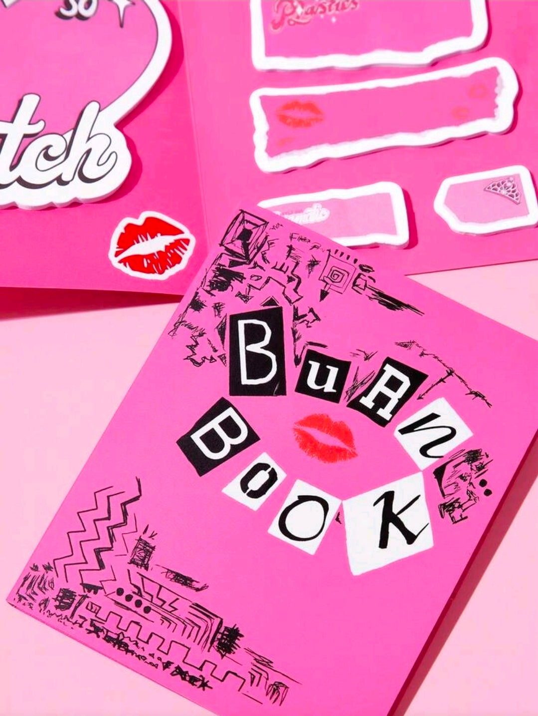 Pink sticky note sheets with “Burn Book” lettering and white label callouts