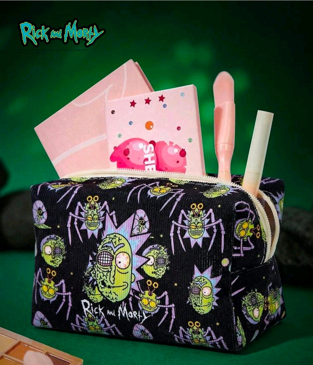 Black corduroy makeup bag with character print, with character powder puff and brush.