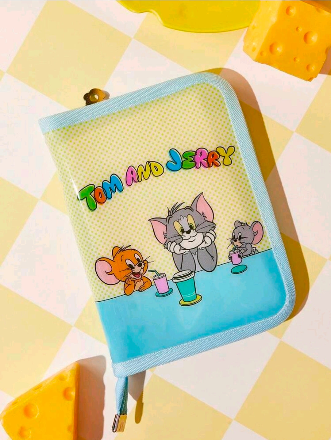 Light blue zipper organizer binder with Tom and Jerry character artwork on the front.