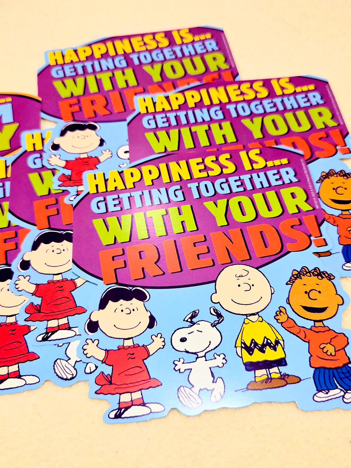 Peanuts wall decor set of multiple cutouts with text: "Happiness is..." and friends characters