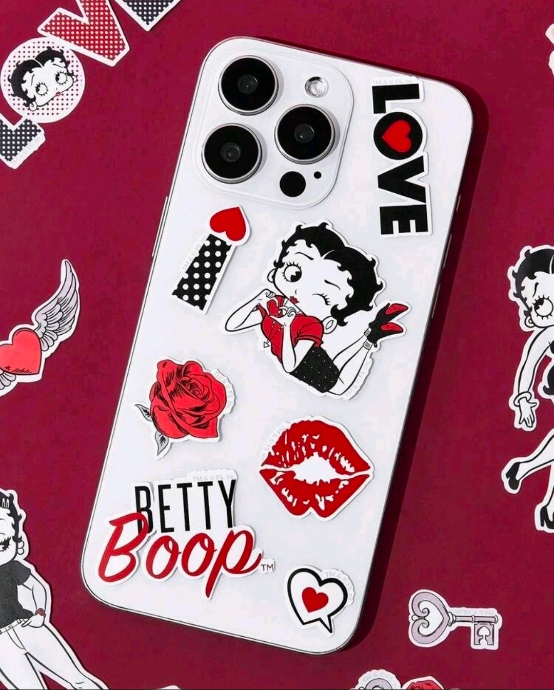 Betty Boop phone case covered with character, hearts, lips, and rose stickers