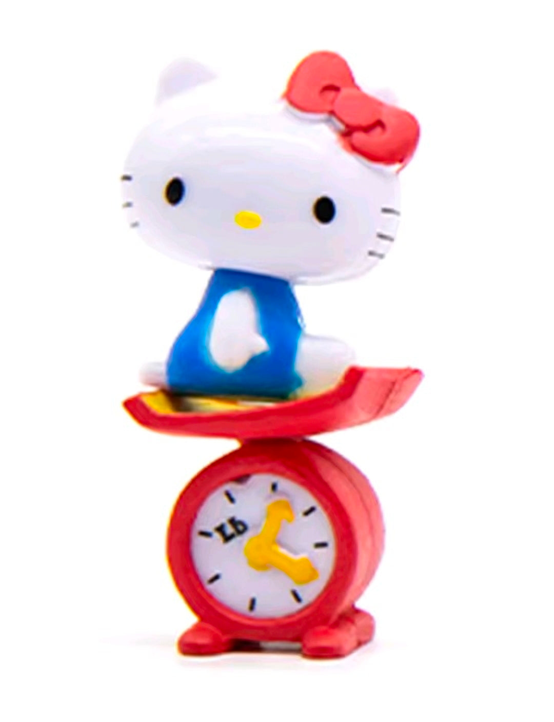Hello Kitty mini figure posed with a red alarm clock and blue rocking base