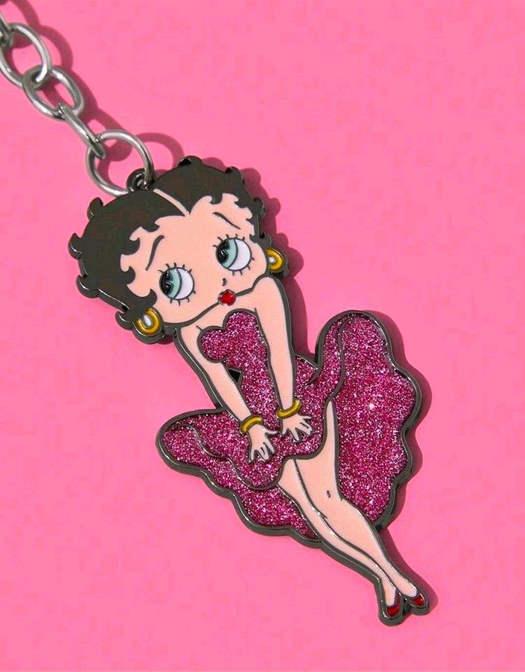 Glitter character charm pendant on a chain, pink heart-shaped dress design