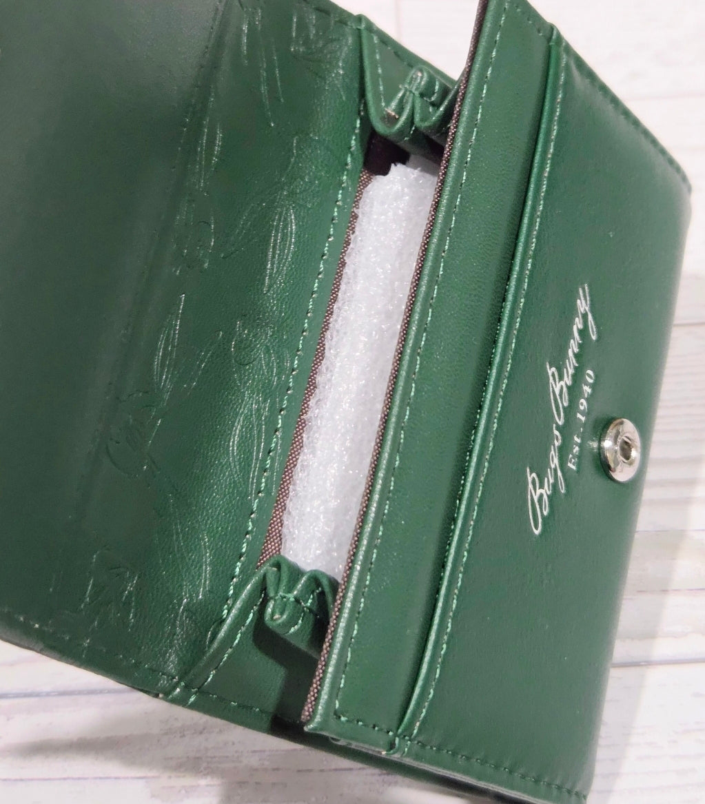 Green wallet side view with card slots, snap hardware, stitched trim