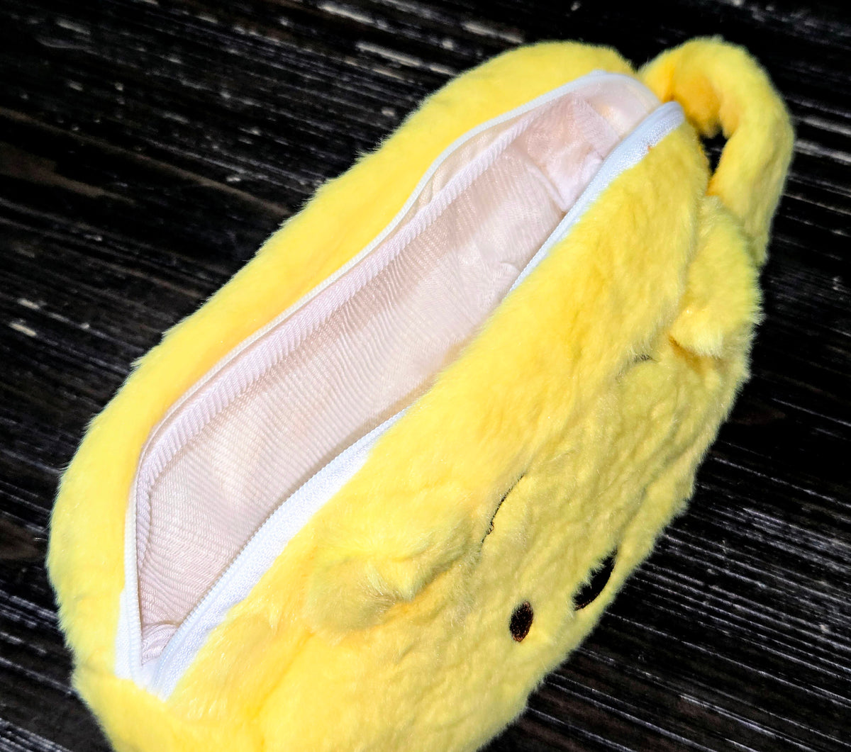 Winnie the Pooh plush zipper pouch with zipper opening and pale lining
