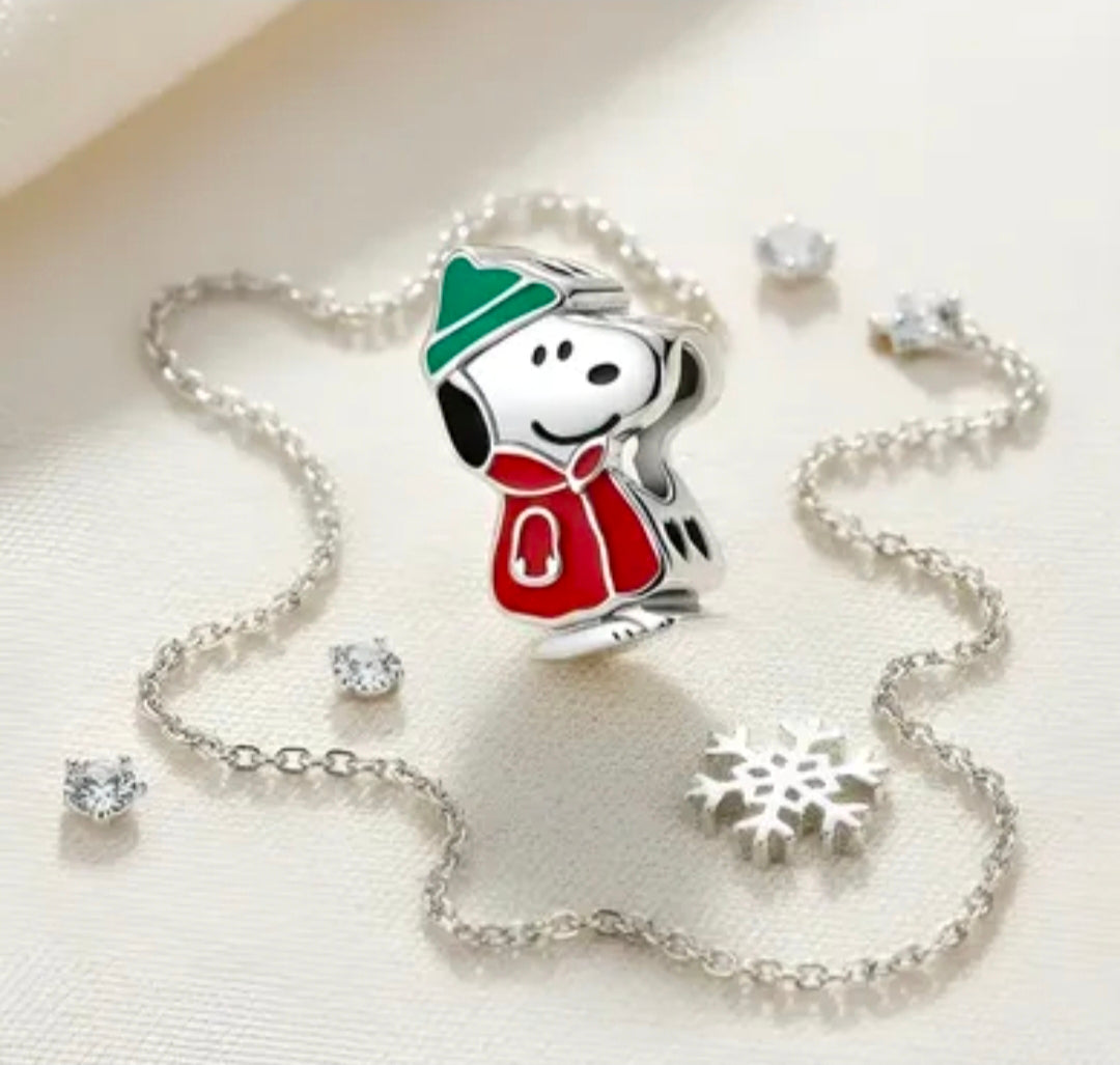Sterling silver bracelet with Snoopy winter puffer coat charm, green hat, red coat, snowflake