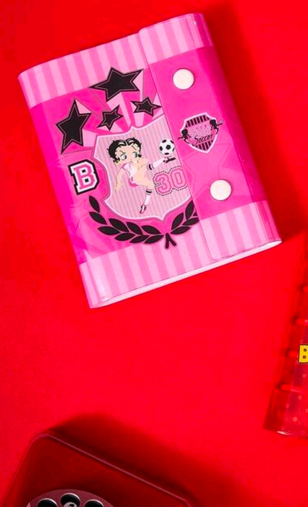 A7 ring binder photo album close-up: pink striped cover with Betty Boop soccer design
