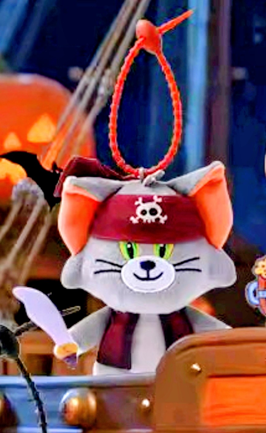 Pirate cat plush keychain with green eyes and red-trimmed pirate hat loop