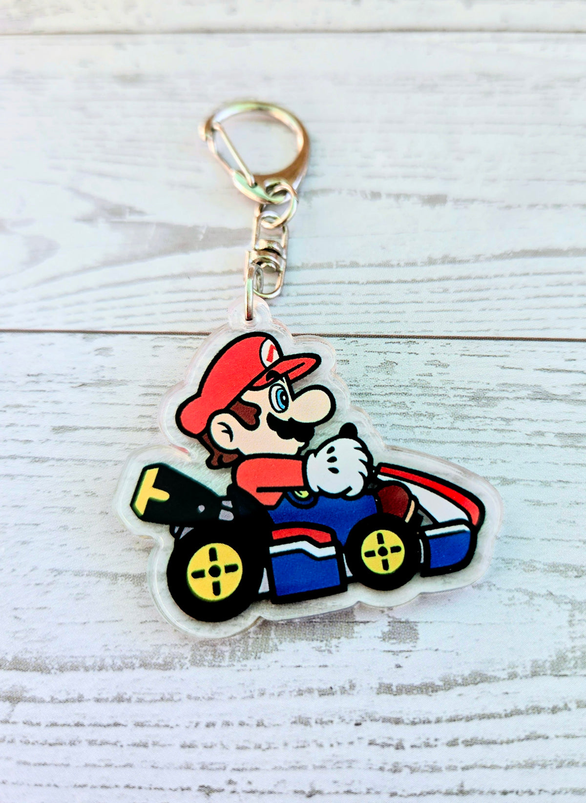 Mario racing acrylic keychain with gold ring, die-cut on clear backing