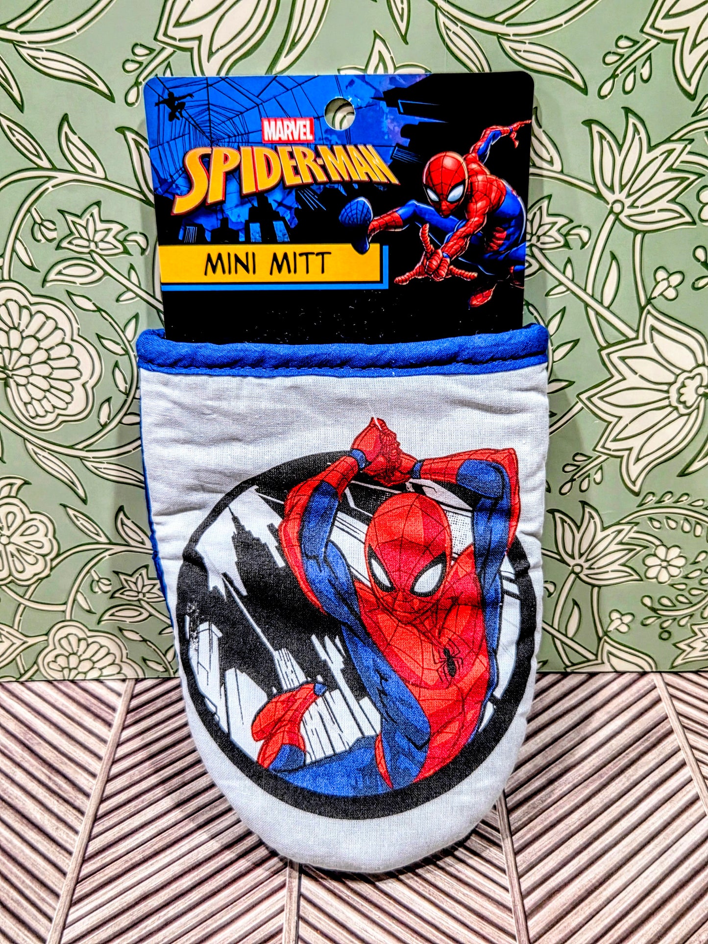 Spider-Man mini mitt on packaging card, white fabric with red-and-blue print