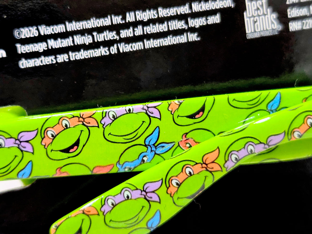 Green TMNT phone grip panel with character print pattern