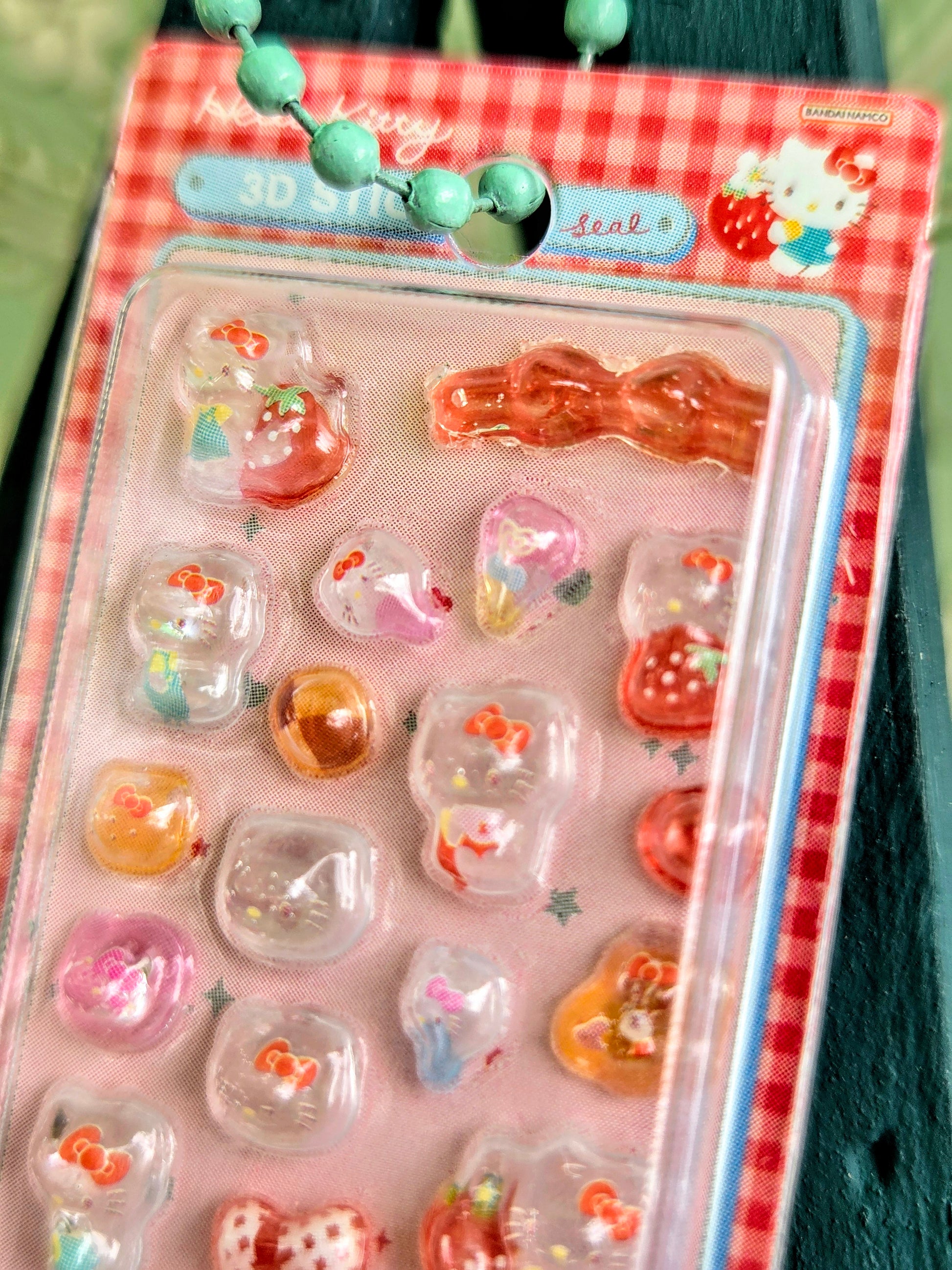 Hello Kitty 3D sticker blister pack with red-orange character stickers and keychain tag