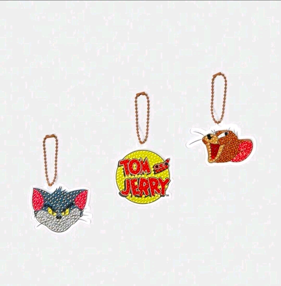 Diamond painting keychain kit with Tom and Jerry charms and cat charm, each on a bead loop