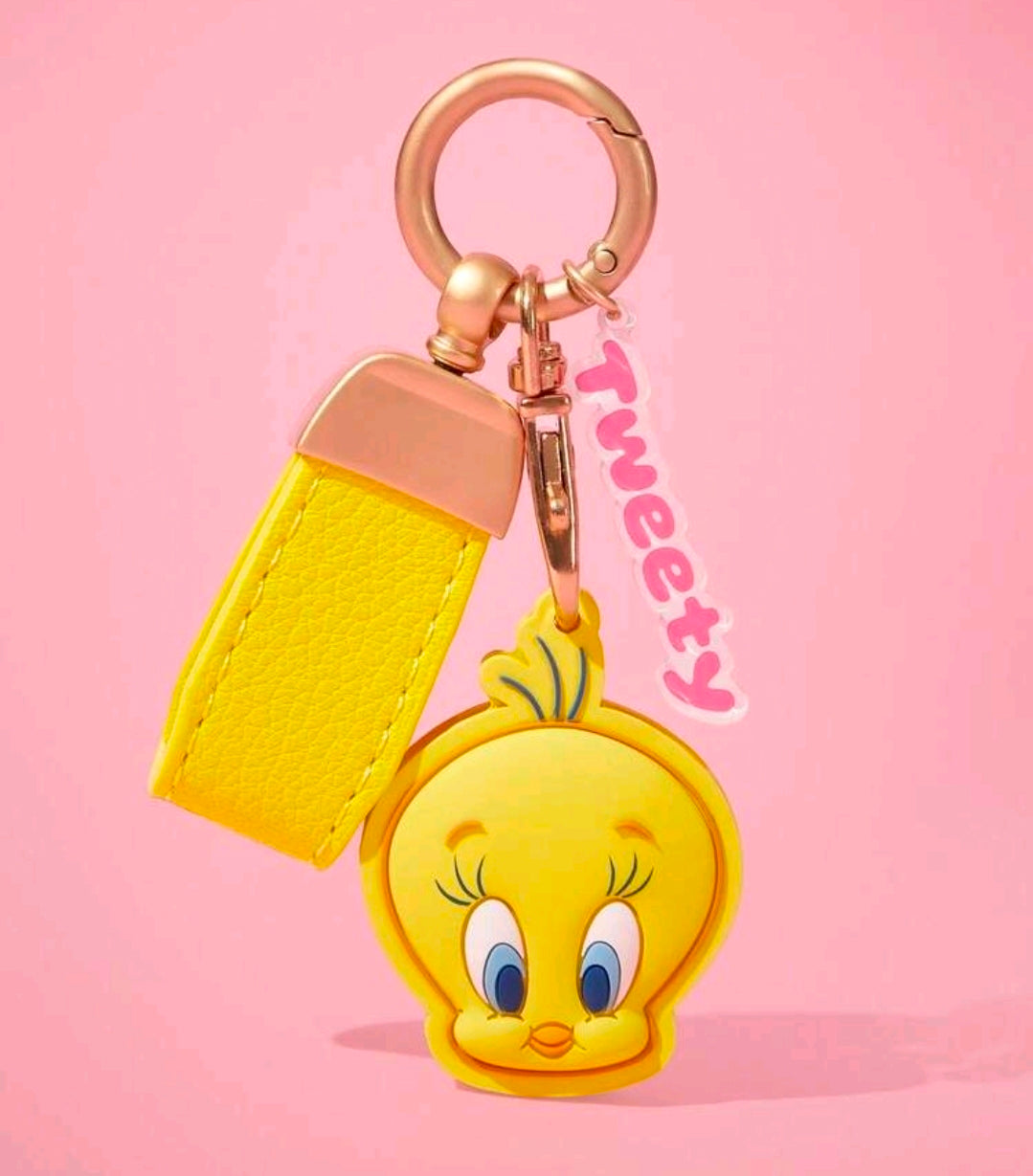 Yellow strap keychain with gold ring, Tweety Bird face charm, and pink tag