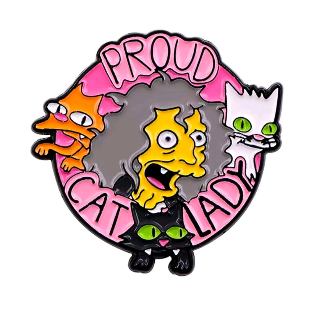 Round enamel pin with yellow face, three cats, and “PROUD CAT LADY” wording
