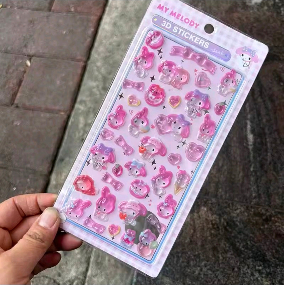 3D acrylic sticker set with pink and light blue cute character charms on a card