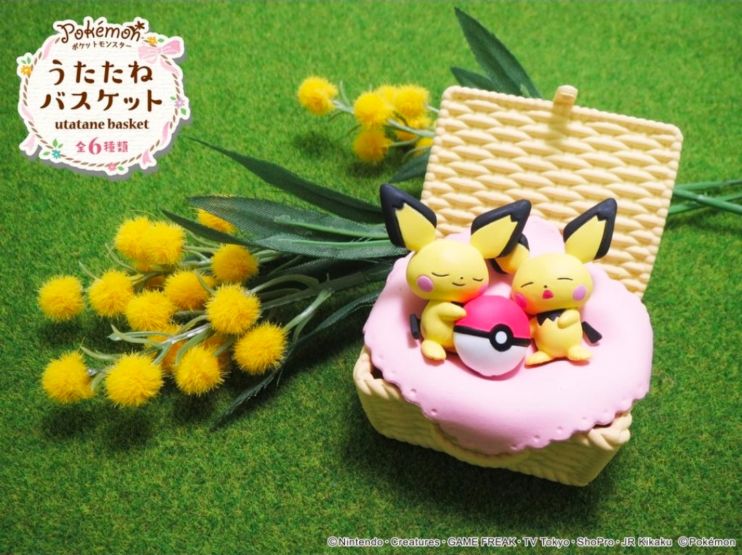 Pikachu nap basket figure with pink blanket and small Pikachu characters curled up.