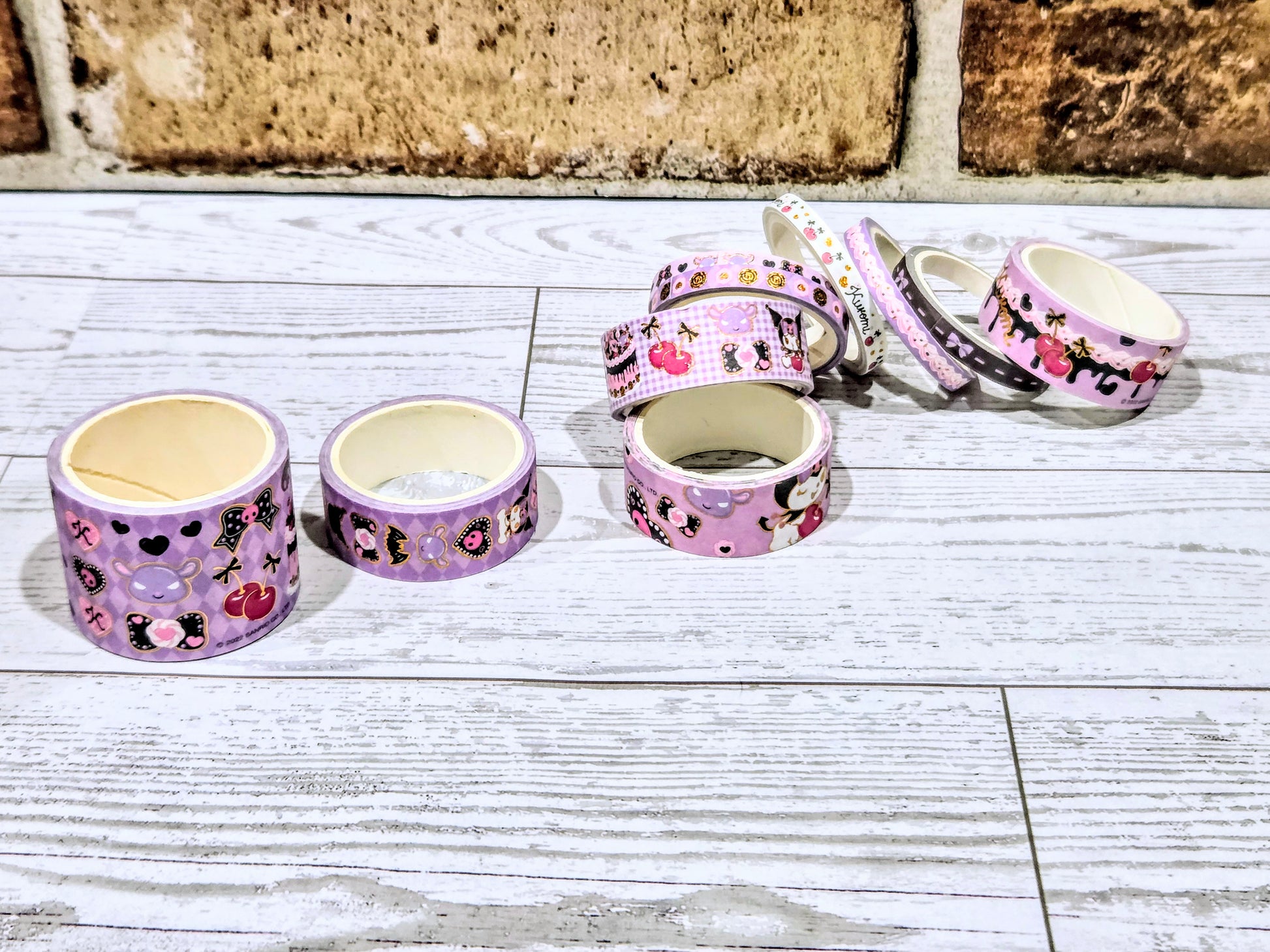 Purple and pink Kuromi washi tape rolls with character prints and bows