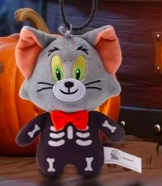 Grey plush cat skeleton keychain with green eyes, red bow tie, bead chain