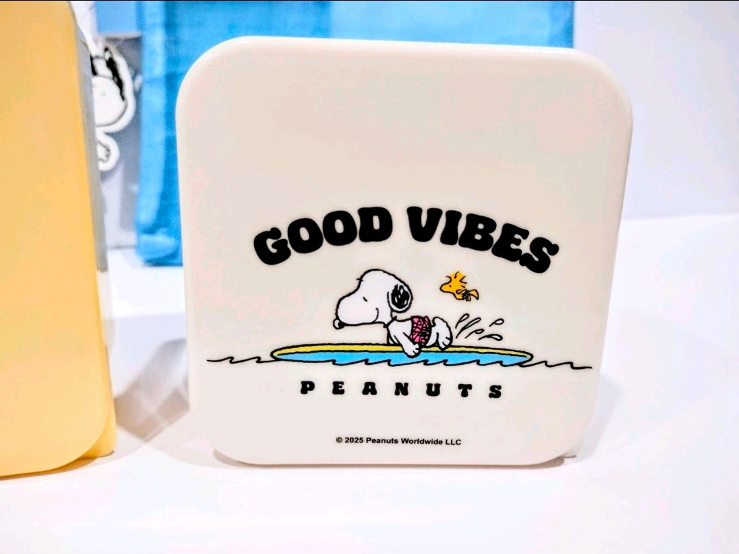 White mini storage tin with “GOOD VIBES” Peanuts Snoopy graphic