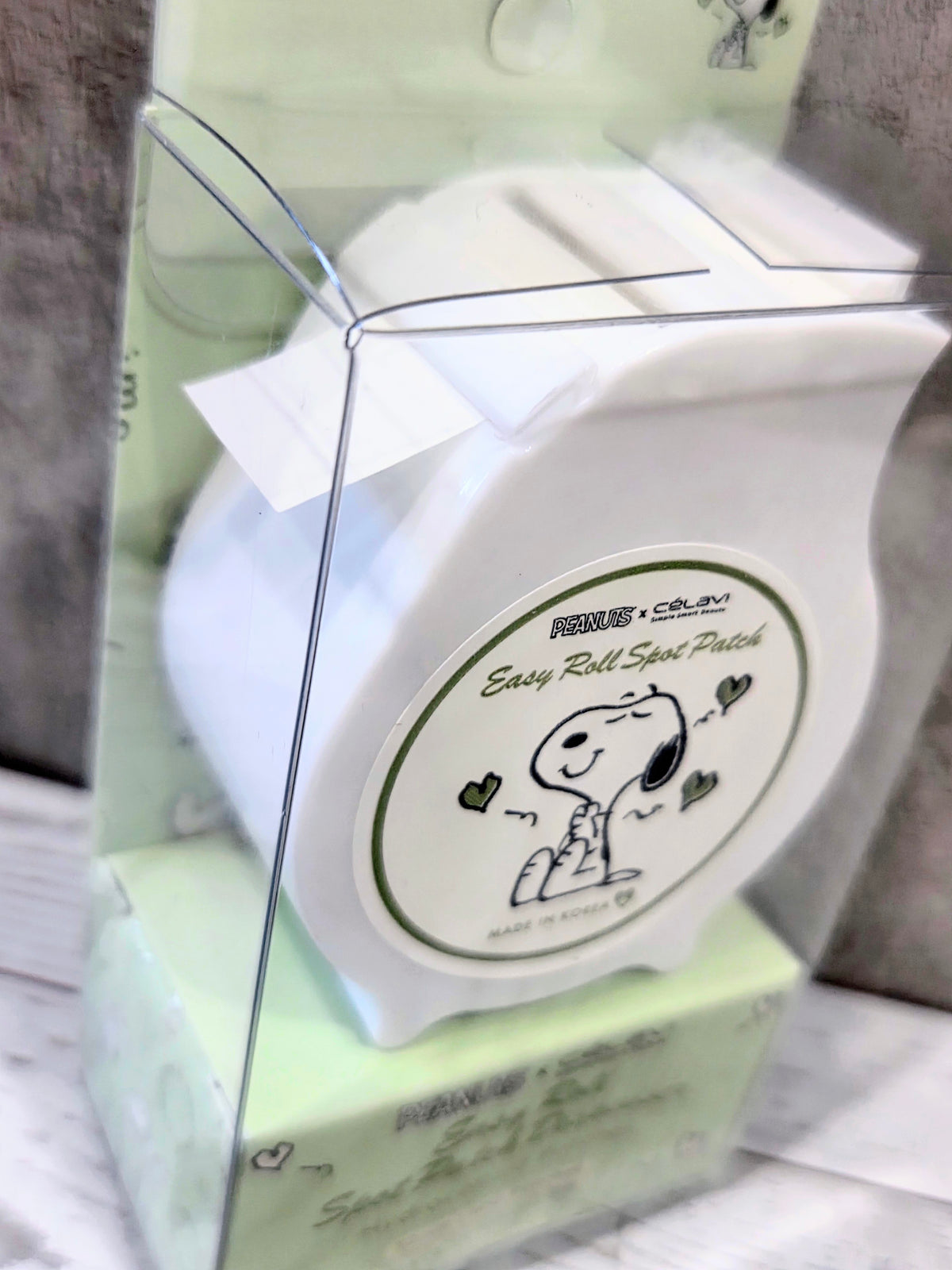 Peanuts x Celavi Easy Roll Spot Patch Dispenser logo sticker on lime packaging