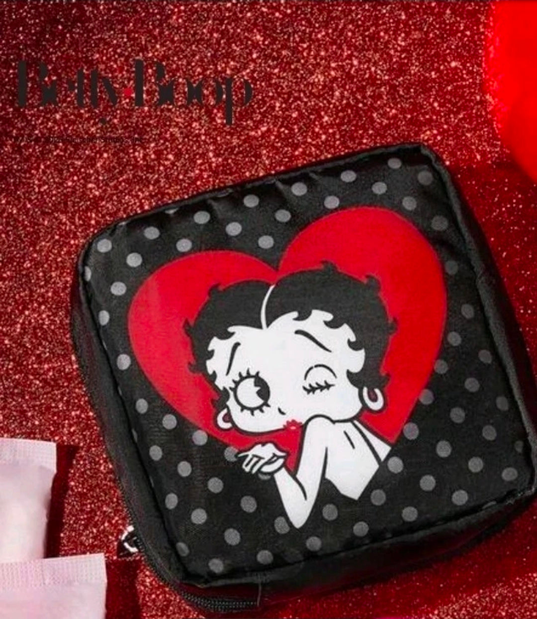 Black polka-dot zipper pouch featuring Betty Boop holding a red heart graphic