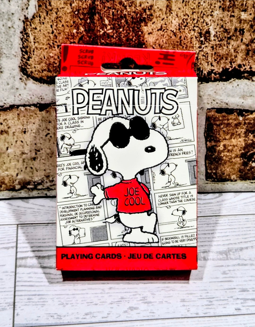 Peanuts Joe Cool Snoopy playing cards box with red top and PEANUTS text