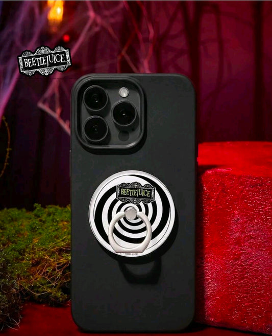 Matte black phone back with metal stick-on ring grip featuring white-and-black spiral