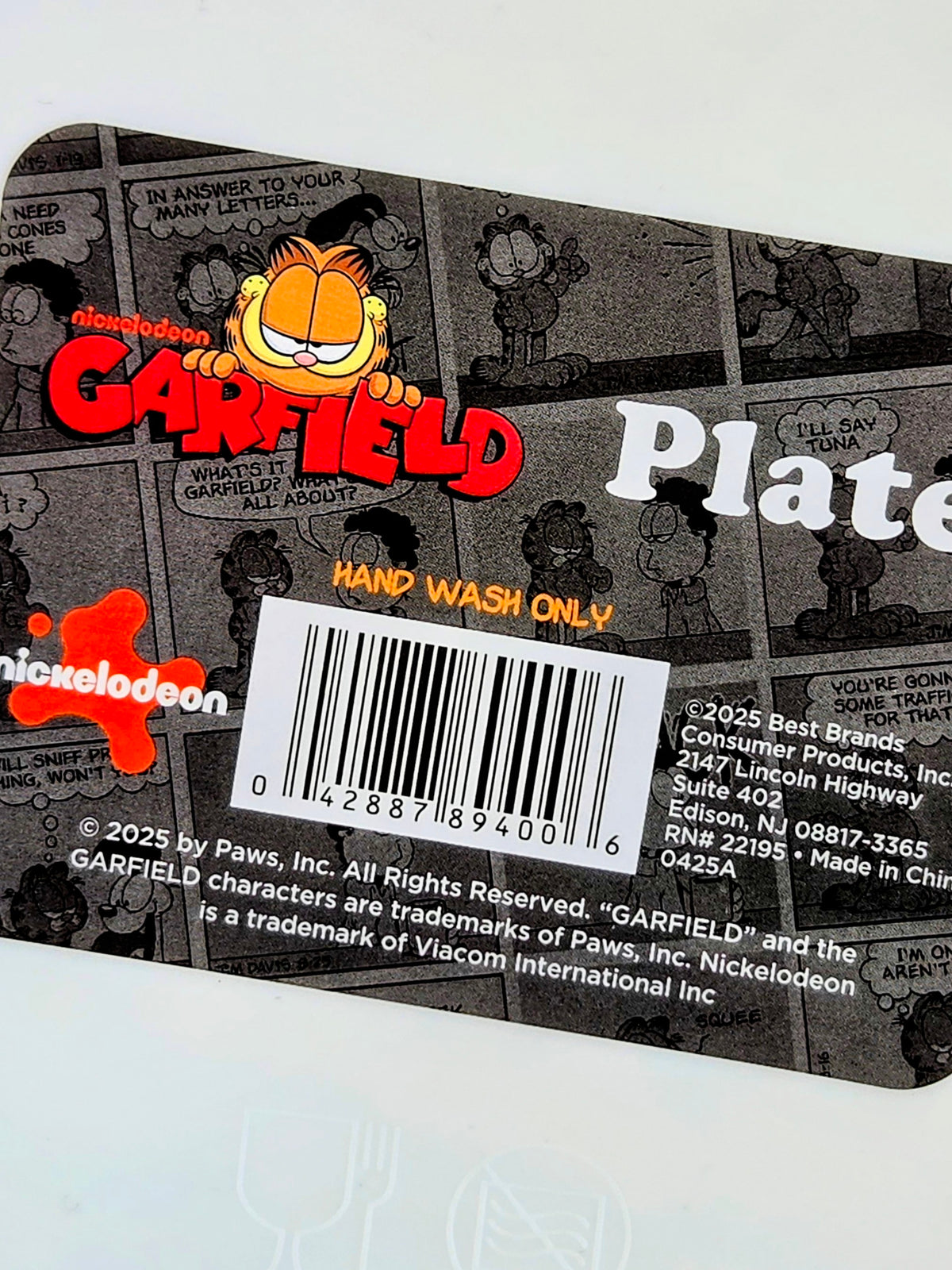 Garfield plate label close-up with “Hand wash only” and barcode