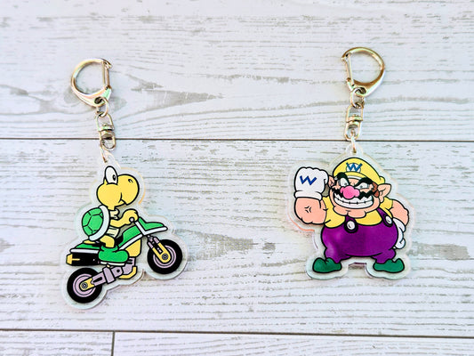 Acrylic keychain set with Koopa Troopa scooter charm and Wario purple charm