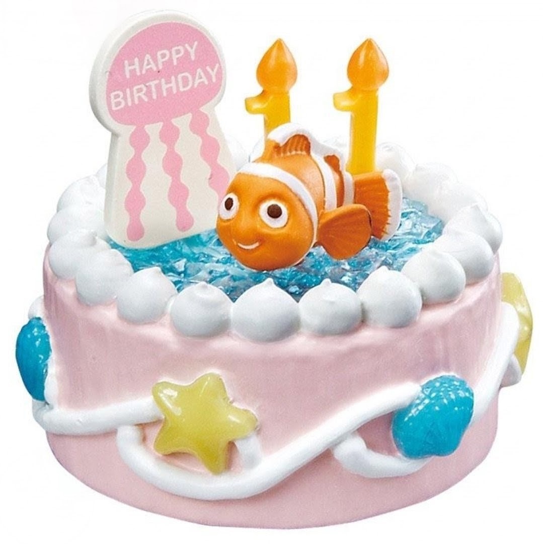 Nemo on pink and blue birthday cake miniature figure with candles