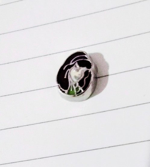 Character floating charm: dark-haired figure with green scarf on round silver base