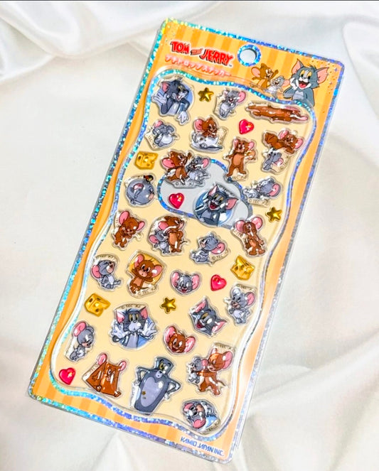 3D acrylic sticker sheet with Tom and Jerry style figures, hearts, and small stars