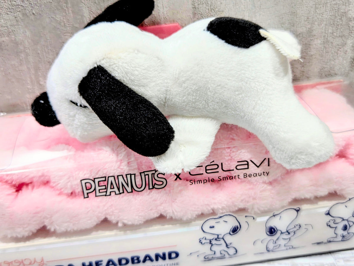 Snoopy plush spa headband with white fur, black ear details, and pink band