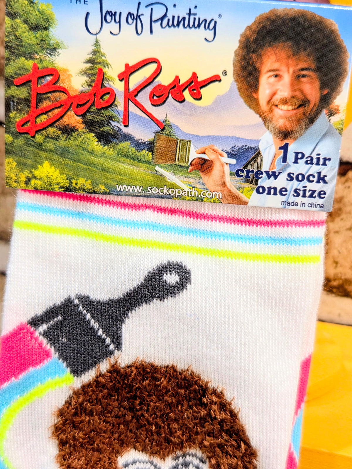 Crew sock in retail box packaging with the Joy of Painting design