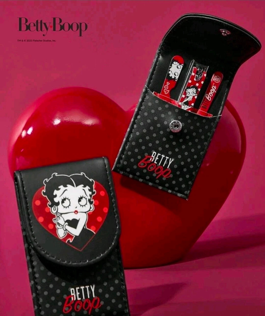 Black polka-dot travel pouch holding mini nail tools with Betty Boop heart patch