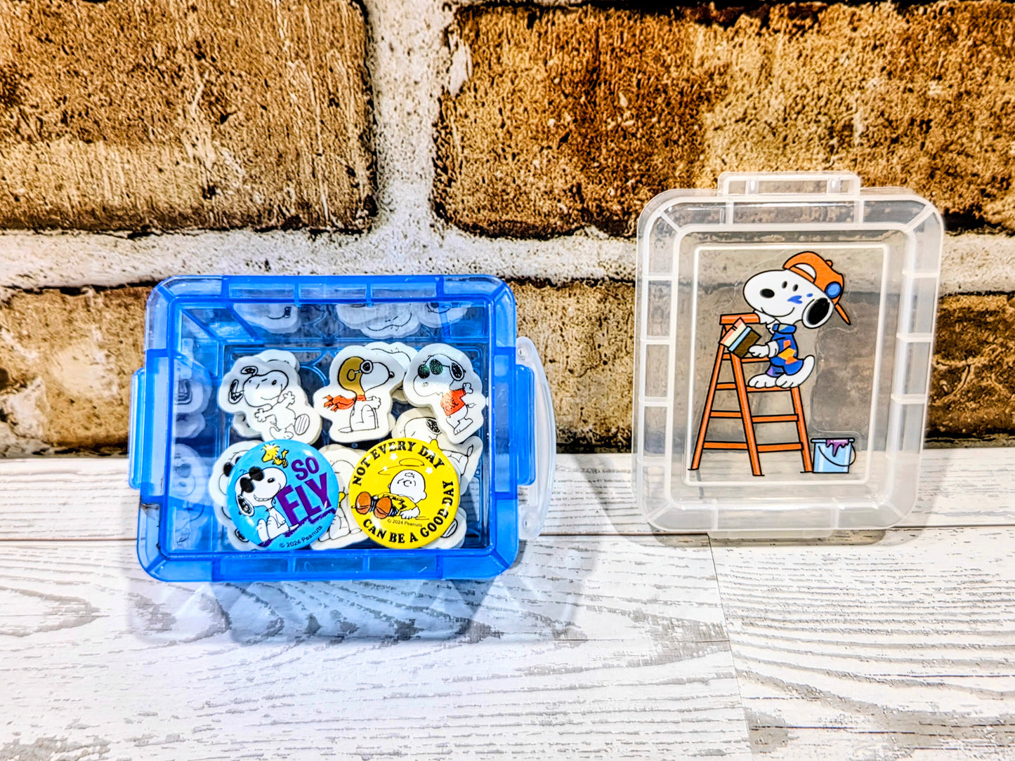 Mini desktop organizer box set with blue compartment and clear box holding Snoopy erasers