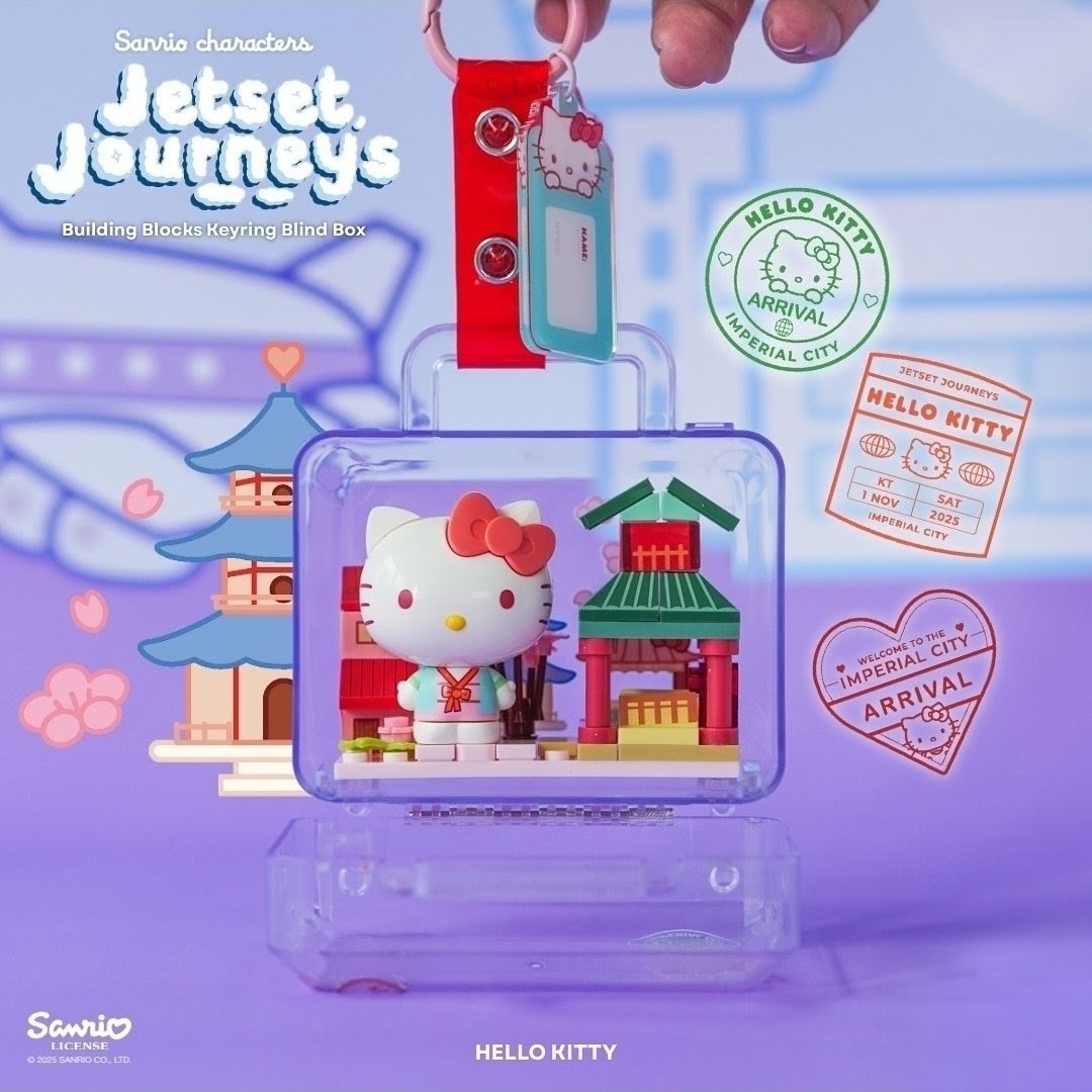 Hello Kitty Jetset Journeys building block keychain with red strap and green tag