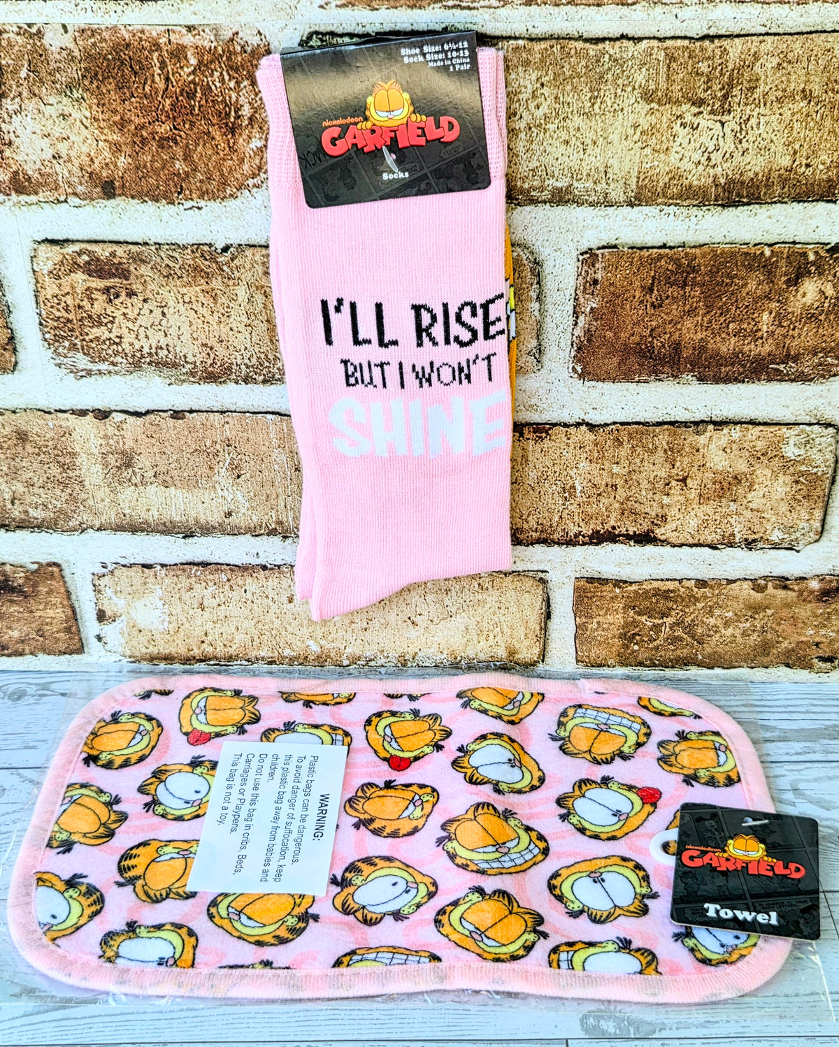 Pink Garfield crew socks on card, with 'I'll Rise But I Won't Shine' text front.