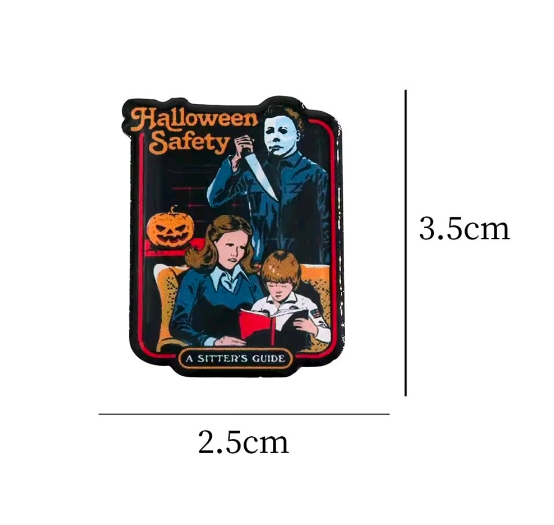 Halloween Safety enamel pin badge with Michael Myers, pumpkins, and "A Sitter's Guide"