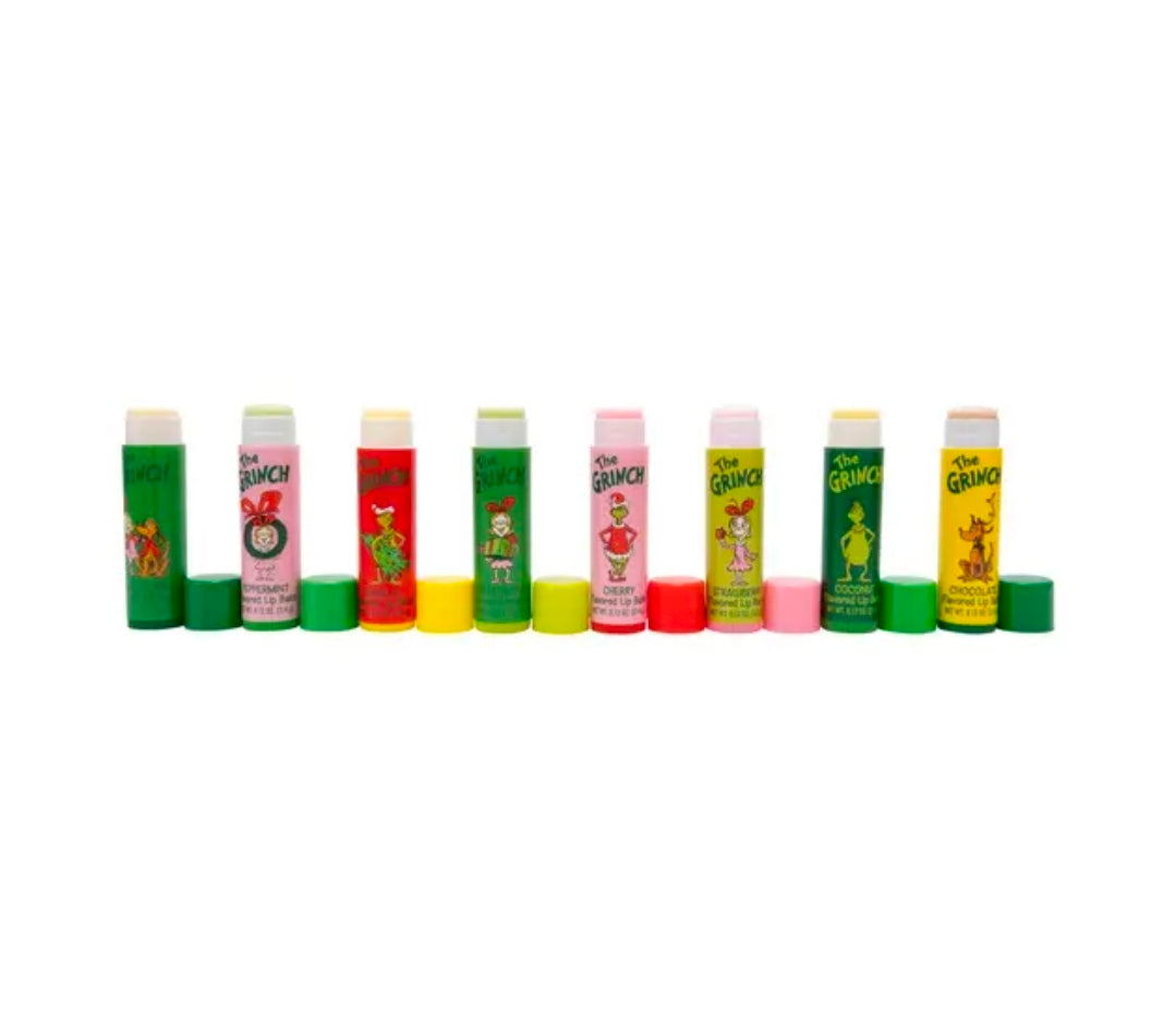 Eight flavored lip balm tubes with colorful tops, displayed side by side