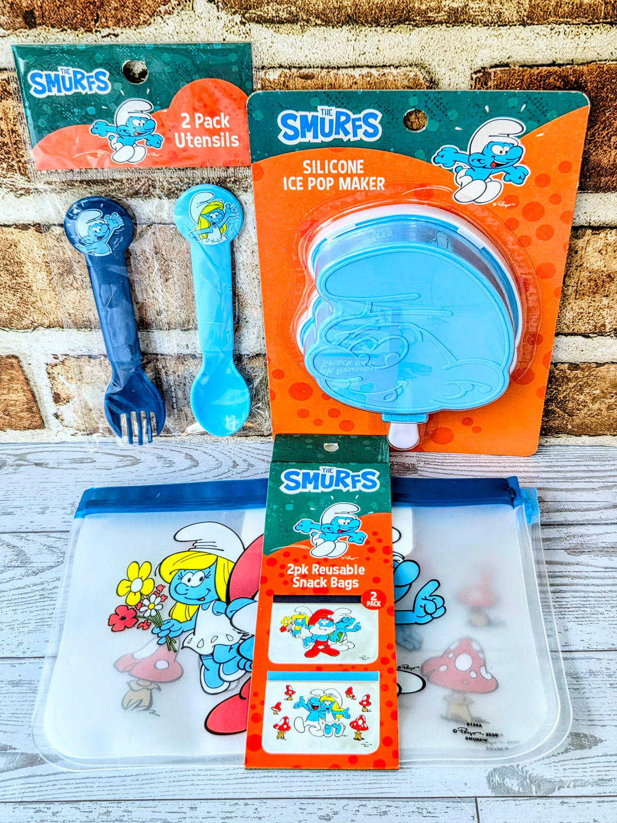 Smurfs gift set includes blue silicone ice pop mold, utensils, and snack bags
