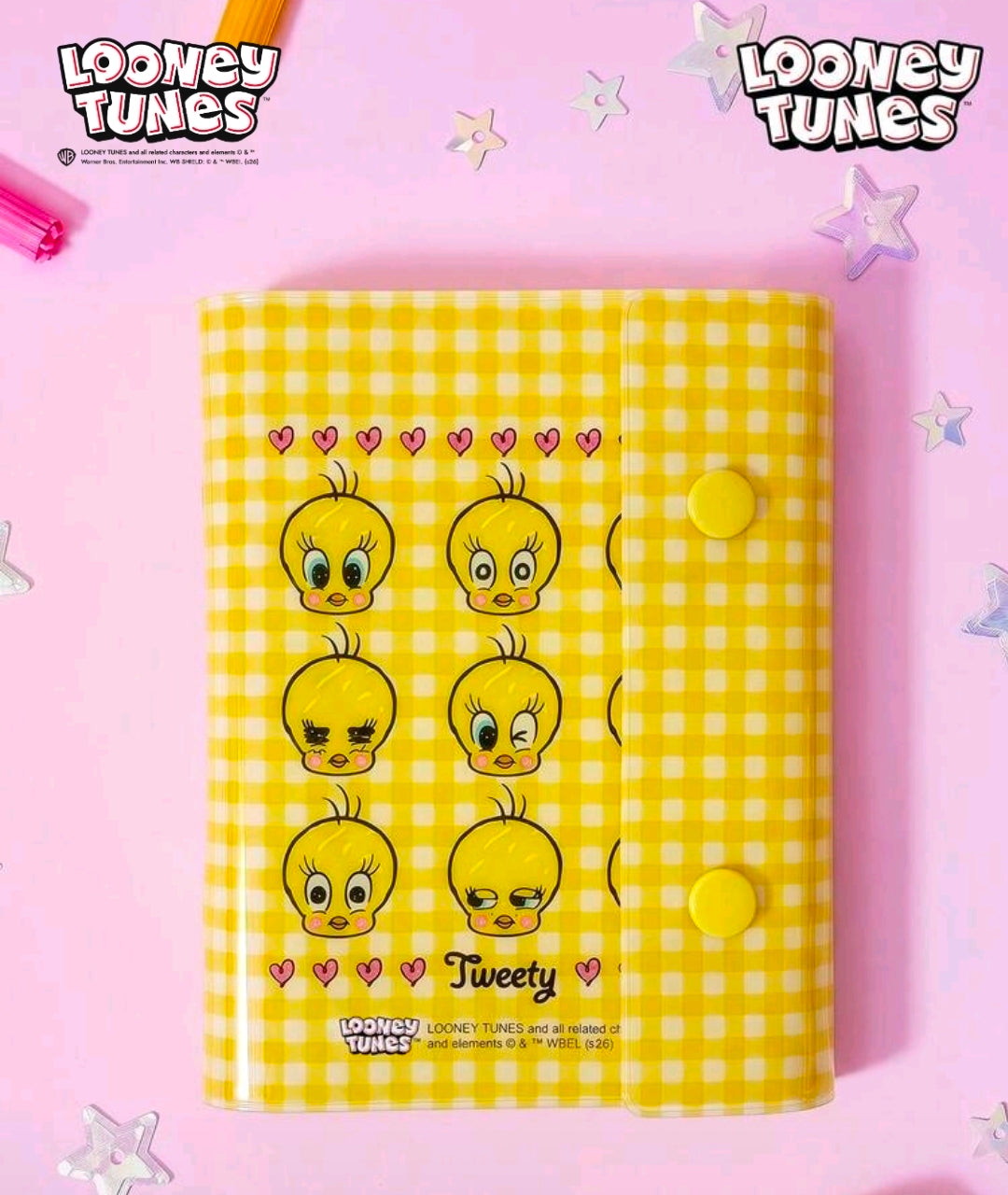 Yellow gingham sticker binder planner with grid of Tweety faces on cover
