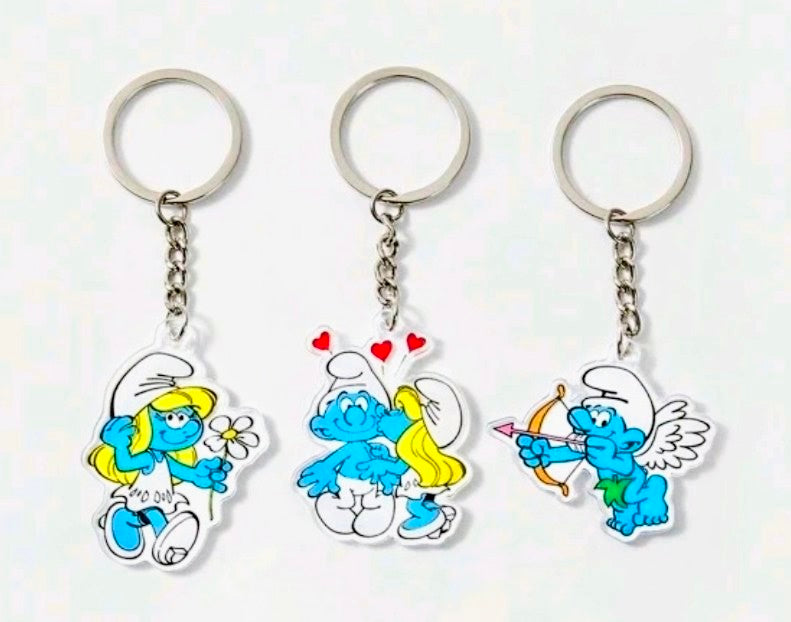 Three cartoon Smurf character acrylic keychains on silver key rings