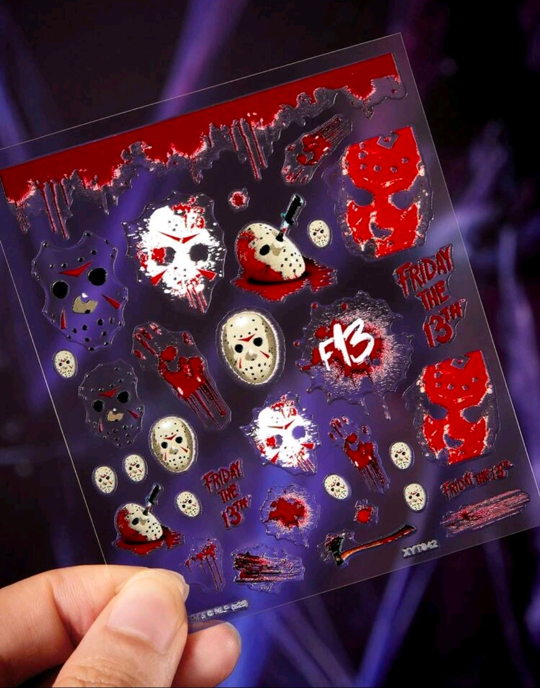 Horror nail art sticker sheet with mixed red, black, and white nail designs