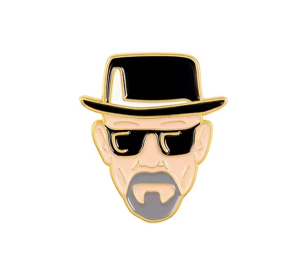 Enamel pin close-up of Heisenberg’s face with black hat and sunglasses